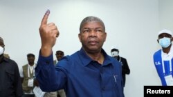 FILE - Angola's President and leader of the People's Movement for the Liberation of Angola (MPLA) ruling party Joao Lourenco gestures after casting his vote in a general election in the capital Luanda, Angola, Aug. 24, 2022. 