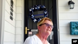 Retiree Virginia Torres sits on her porch in Cheyenne, Wyo., July 19, 2022. Torres said she plans to vote for Harriet Hageman in Wyoming's Republican congressional primary election Aug. 16. She said she does not support incumbent Rep. Liz Cheney because it seems like she has a personal vendetta against former President Donald Trump.