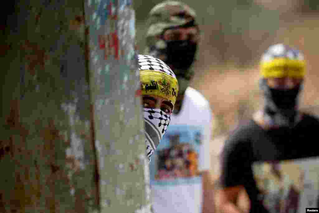 Palestinians protest against Israeli settlement activity near Nablus in the Israeli-occupied West Bank.