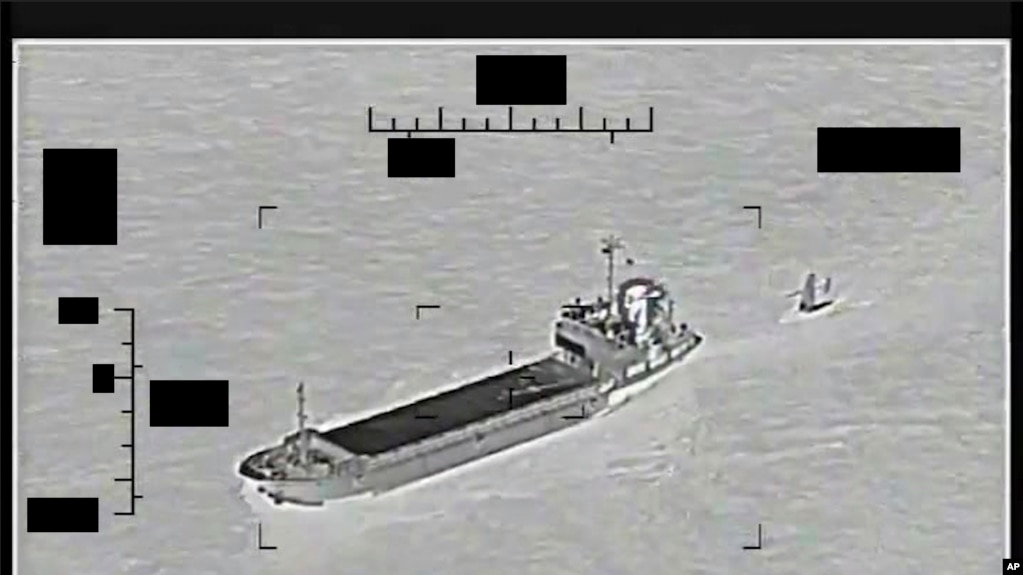 This photo released by the US Navy shows the Iranian Revolutionary Guard ship 'Shahid Bazair', left, towing a US Navy Saildrone Explorer in the Persian Gulf on Aug. 30, 2022. 
