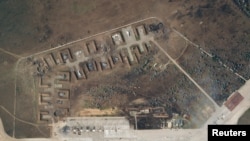 A satellite image shows destroyed Saky air base in Crimea, Aug. 10, 2022. (Planet Labs PBC/Handout via Reuters)