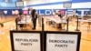 A voter checks in at Suffield Middle School on primary Election Day, Aug. 9, 2022, in Suffield, Conn. 