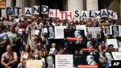 Writers and supporters gather in solidarity with Salman Rushdie outside the New York Public Library, Aug. 19, 2022, in New York.