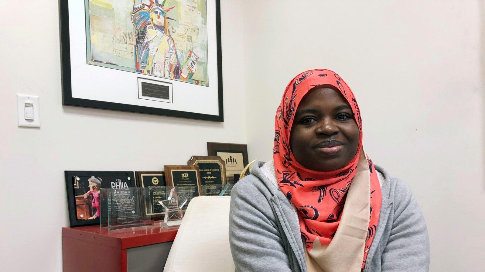 FILE - Fartun Abdi, a 25-year-old Somalian sits at work in Nashville, Tennessee, Dec. 17, 2019. 