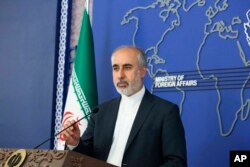 In this photo released on Thursday, Aug. 11, 2022, by the Iranian Foreign Ministry, Foreign Ministry spokesperson Nasser Kanaani speaks in Tehran, Iran. (Iranian Foreign Ministry via AP)