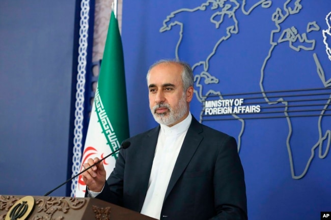 In this photo released on Thursday, Aug. 11, 2022, by the Iranian Foreign Ministry, Foreign Ministry spokesperson Nasser Kanaani speaks in Tehran, Iran. (Iranian Foreign Ministry via AP)