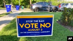 FILE - In this photo from July 14, 2022, a sign in a yard in Merriam, Kansas, urges voters to oppose a proposed amendment to the Kansas Constitution to allow legislators to further restrict or ban abortion. Voters ultimately rejected the proposal.