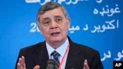 FILE - Russian presidential envoy to Afghanistan Zamir Kabulov speaks to media during talks involving Afghan representatives in Moscow, Russia, Oct. 20, 2021.