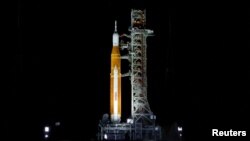 NASA’s next-generation moon rocket, the Space Launch System rocket with its Orion crew capsule perched on top, stands on launch pad 39B in preparation for the unmanned Artemis 1 mission at Cape Canaveral, Florida, Aug. 27, 2022.