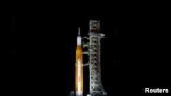 NASA’s next-generation moon rocket, the Space Launch System rocket with its Orion crew capsule perched on top, stands on launch pad 39B in preparation for the unmanned Artemis 1 mission at Cape Canaveral, Florida, Aug. 27, 2022. 