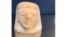 FILE- Photo by U.S. Customs and Border Protection of an Egyptian canopic jar lid of the funeral deity, Imsety, seized by agents in Memphis that was shipped in from Europe, Aug. 17, 2022.