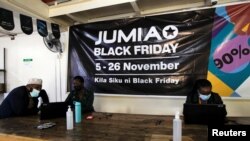 FILE: Workers are seen inside an Africa-focused tech startup Jumia Technologies, pickup station in downtown Nairobi, Kenya. Taken 11.16.2021