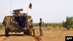 FILE - This file photo taken on August 2, 2018 shows German soldiers during a patrol on the route from Gao to Gossi, Mali. In 2023, Germany announced it was ending its presence in Mali, with that pullout accelerated in June.