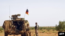  FILE - German soldiers during a patrol on the route from Gao to Gossi, Mali, August 2, 2018.