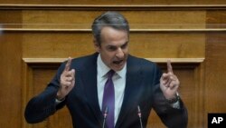 Greek Prime Minister Kyriakos Mitsotakis speaks during a parliament session in Athens, Aug. 26, 2022. 