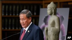 Surrounded by Cambodian antiquities, Cambodian ambassador to the United States Keo Chhea speaks during a news conference in New York, Monday, Aug. 8, 2022. (AP Photo/Seth Wenig)