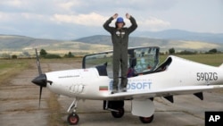 Mack Rutherford, a 17-year-old British-Belgian pilot waves after he landed in Sofia-West ariport, Wednesday Aug. 24, 2022. Rutherford has become the youngest person to fly solo around the world in a small aircraft. (AP Photo/ Jordan Simeonov)