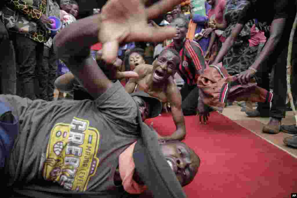 Supporters of presidential candidate Raila Odinga react as he arrives at his campaign headquarters after submitting a petition at the Supreme Court in Nairobi, Kenya.&nbsp;Odinga filed a Supreme Court challenge to last week&#39;s election result, asserting that the process was marked by criminal subversion and seeking that the outcome be nullified and a new vote be ordered.