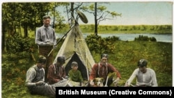 Circa 1910 postcard shows a group of Akwesasne Mohawk men lacing lacrosse sticks on Cornwall Island, Ontario, Canada.