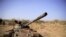 FILE - A destroyed tank is seen in a field in the aftermath of fighting between the Ethiopian National Defense Force (ENDF) and the Tigray People's Liberation Front (TPLF) forces in Kasagita town, in Afar region, Ethiopia, February 25, 2022. 