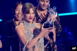 FILE - Taylor Swift accepts the award for best long-form video for 'All Too Well (10 Minute Version) (Taylor's Version)' at the MTV Video Music Awards at the Prudential Center on Aug. 28, 2022, in Newark, N.J.