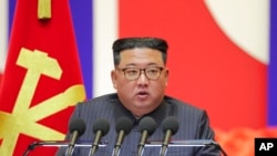 FILE - In this photo provided by the North Korean government, North Korean leader Kim Jong Un speaks during a 'maximum emergency anti-epidemic campaign meeting' in Pyongyang, North Korea, Aug. 10, 2022.