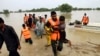 Army troops evacuate people from a flood-hit area in Rajanpur, district of Punjab, Pakistan, Aug. 27, 2022. Officials say flash floods triggered by heavy monsoon rains across much of Pakistan have killed nearly 1,000 people and displaced thousands more.