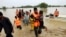 Army troops evacuate people from a flood-hit area in Rajanpur, district of Punjab, Pakistan, Aug. 27, 2022. Officials say flash floods triggered by heavy monsoon rains across much of Pakistan have killed nearly 1,000 people and displaced thousands more.