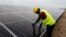 FILE: A technician works on solar power panels at the Atlantic Shrimpers farm in Badagry, Lagos, Nigeria. Taken July 5, 2022.