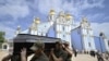 Ukrainian soldiers carry the coffin of late serviceman Roman Barvinok after a funeral service in St. Michael's Golden-Domed Cathedral in Kyiv, Aug. 28, 2022, amid the Russian invasion of Ukraine. 