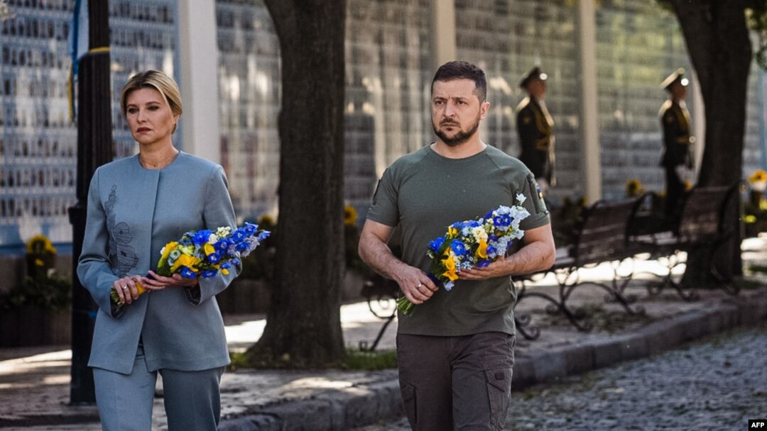 This handout photo taken and released by the Ukrainian presidential press service on Aug. 24, 2022, shows Ukrainian President Volodymyr Zelenskyy and his wife Olena attending a commemoration ceremony in Kyiv for Ukrainians killed since Russia invaded.