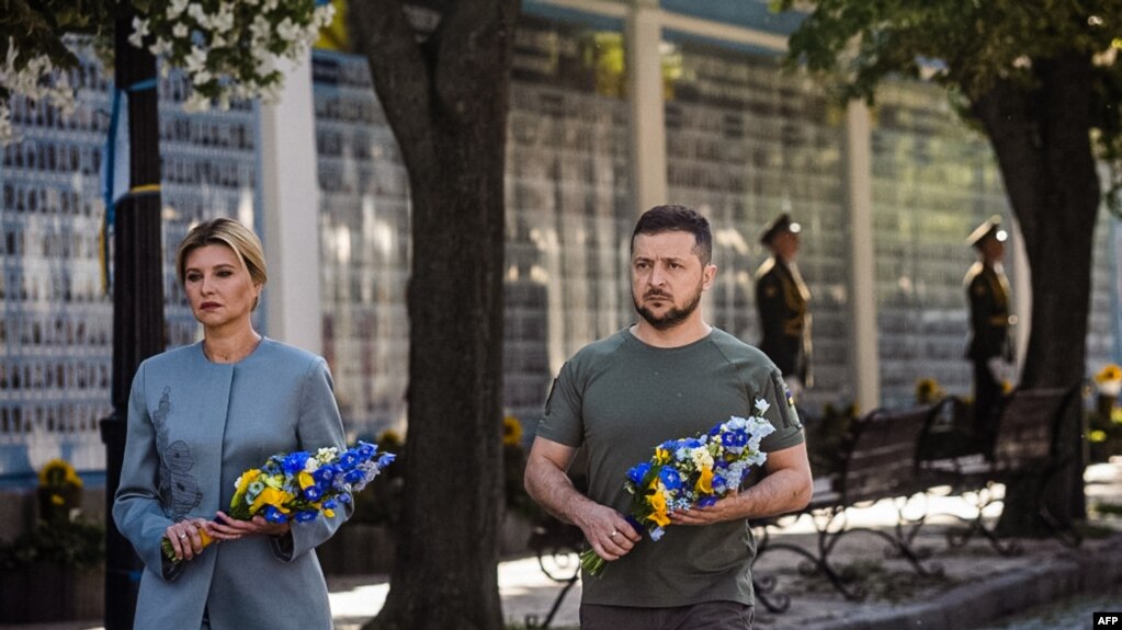 This handout photo taken and released by the Ukrainian presidential press service on Aug. 24, 2022, shows Ukrainian President Volodymyr Zelenskyy and his wife Olena attending a commemoration ceremony in Kyiv for Ukrainians killed since Russia invaded.