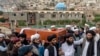 Mourners carry the body of a victim of a mosque bombing in Kabul, Afghanistan, Aug. 18. 2022. The bombing at a Kabul mosque during evening prayers on Wednesday killed at least 10 people, including a prominent cleric, and wounded over two dozen, 