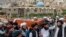 Mourners carry the body of a victim of a mosque bombing in Kabul, Afghanistan, Aug. 18. 2022. The bombing at a Kabul mosque during evening prayers on Wednesday killed at least 10 people, including a prominent cleric, and wounded over two dozen, 