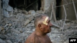 Oleksandr Shulga looks at his destroyed house following a missile strike in Mykolaiv Aug. 29, 2022. Ukrainian forces have begun a counterattack to retake the southern city of Kherson, which is currently occupied by Russian troops, a local government official said Monday. 