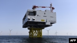 FILE - Wind turbines are pictured at the Arkona wind park on June 5, 2019, in the Baltic Sea, northern Germany. 