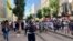 Tunisian reporters cover a demonstration in the capital Tunisa. (Lisa Bryant/VOA)