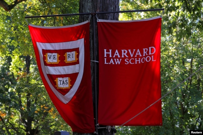 FILE - Banners for Harvard Law School fly in Cambridge, Massachusetts, U.S., October 5, 2018. Harvard and many American colleges have strict rules regarding copyright and plagiarism. (REUTERS/Brian Snyder/File Photo)