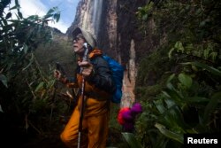 Japanese tourists walk down from the top of Mount Roraima, near Venezuela's border with Brazil, Jan. 18, 2015.