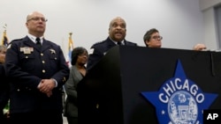 FILE - Chicago Police Superintendent Eddie Johnson, center, speaks during a news conference Sept. 21, 2016, in Chicago, Illinois. Johnson has described Monday's beating, broadcast live on Facebook, as “sickening.”
