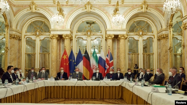 FILE - Officials wait for the start of a meeting of the JCPOA Joint Commission in Vienna, Austria, Nov. 29, 2021. (EU Delegation in Vienna/handout via Reuters)