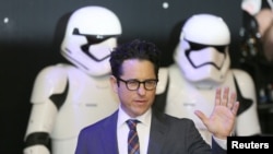 FILE - Director J.J. Abrams arrives at the European Premiere of Star Wars, The Force Awakens in Leicester Square, London, Dec.16, 2015. He new nine-part documentary series will be called 'Moon Shot'