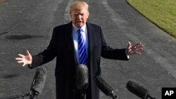 FILE - In a Saturday, Dec. 16, 2017 file photo, President Donald Trump talks with reporters as he departs from the South Lawn of the White House.