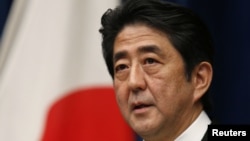 Japan's new Prime Minister Shinzo Abe attends a news conference at his official residence in Tokyo, December 26, 2012.