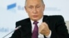 Poutine promet une réplique "rapide" en cas de restrictions des médias russes aux Etats-Unis