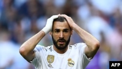 Real Madrid's French forward Karim Benzema reacts during the UEFA Champions league Group A football match between Real Madrid and Club Brugge at the Santiago Bernabeu stadium in Madrid on October 1, 2019.