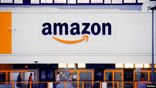 The Amazon logo is seen at the company's logistics center in Bretigny-sur-Orge, near Paris, France, Dec. 7, 2021.