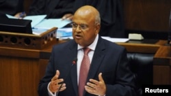 FILE - South African Finance Minister Pravin Gordhan delivers his 2013 Budget speech at Parliament in Cape Town, Feb. 27, 2013. 