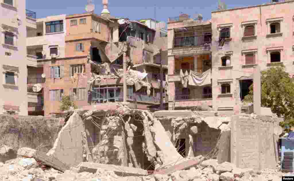Buildings that were damaged after an exchange of fire between Free Syrian Army fighters with regime forces in the Seif El Dawla neighborhood Aleppo.