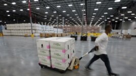 FILE - Boxes containing the Moderna COVID-19 vaccine are prepared to be shipped at the McKesson distribution center in Olive Branch, Mississippi, U.S. December 20, 2020. (Paul Sancya/Pool via REUTERS/File Photo/File Photo)